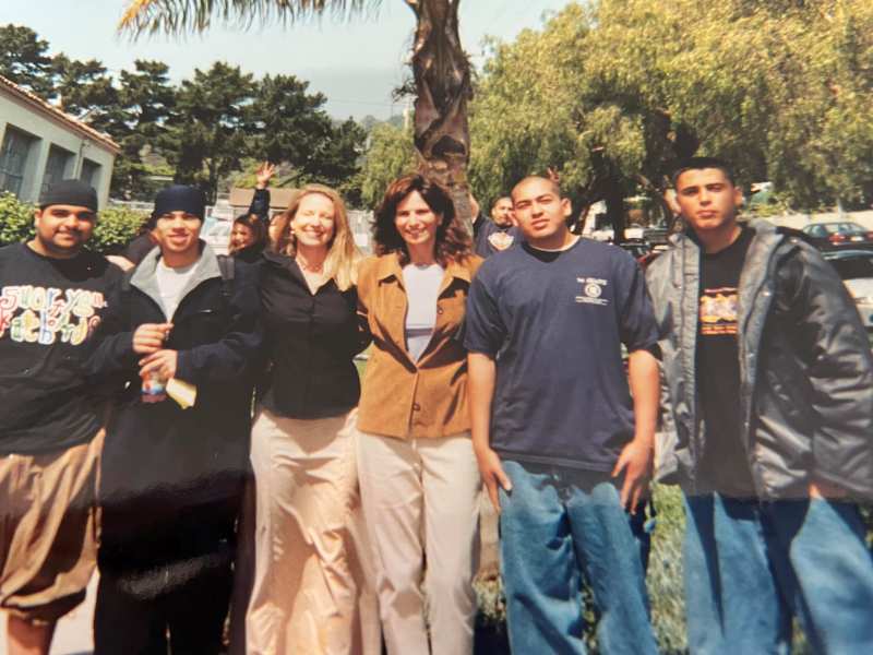 An old photo of Jennifer Freed (in brown coat) with her colleagues