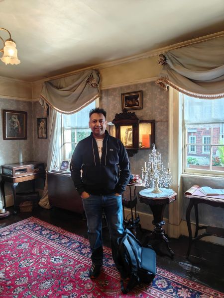 Rahul Kaushl posing for a photo in the house of Sherlock Holmes