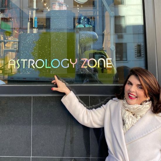 Susan Miller in front of her Astrology Zone carousel shop in New York